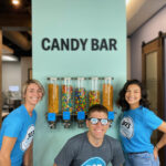 303 Smiles Team in Front Of the candy bar